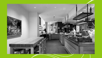 A black and white photo of an open kitchen in a restaurant