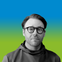 Founder and CEO, David Whitesock's headshot on a blue and green gradient background